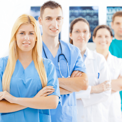 Medical practice workers all standing in a staggered line