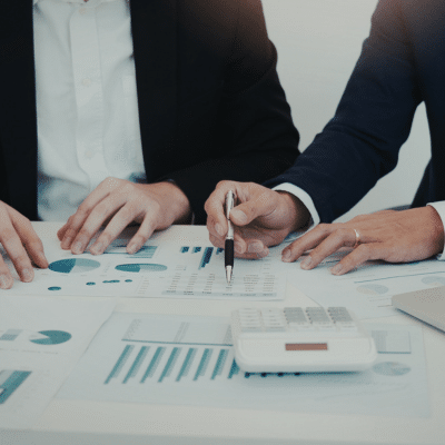 Business meeting with financial documents, representing medical practice budgeting